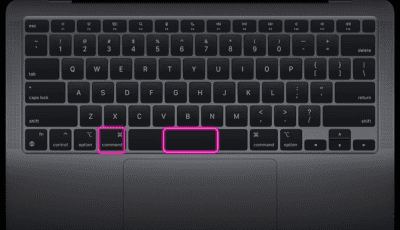 MacBook Air keyboard with the Command key and Spacebar highlighted in pink