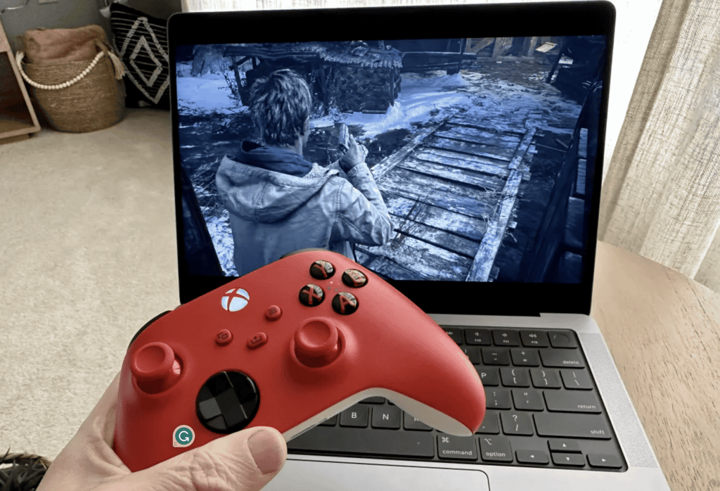 X-Box Gaming Console in front of MacBook Pro 14-inch
